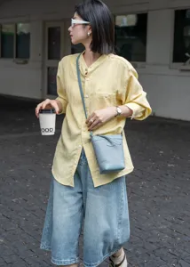 Stylish genuine leather crossbody phone bag in light blue, perfect for daily commute and casual wear.