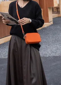 Orange leather crossbody bag for women, genuine cowhide camera shoulder bag daily use.