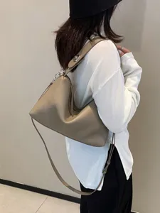 Elegant genuine leather shoulder bag for women, versatile slouchy pillow crossbody design.