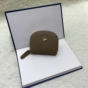Genuine leather mini coin purse for women, compact card holder with cute flower decor, brown.