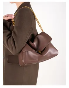 Detailed view of the women's leather shoulder bag with a stylish chunky gold chain strap.