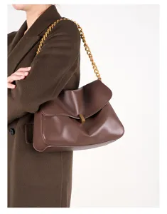 Elegant brown leather shoulder bag with chunky gold chain, stylish commuter handbag for women.