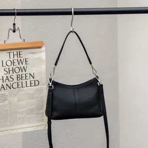 Classic black genuine leather shoulder bag for women, elegant hobo crescent design with strap.