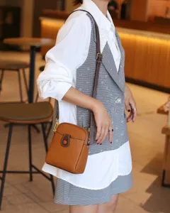Genuine leather mini crossbody bag for women, stylish phone shoulder bag with strap.