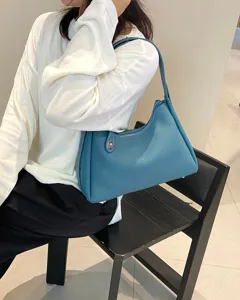 Detailed view of the stylish blue leather shoulder bag, elegant design for women daily use.