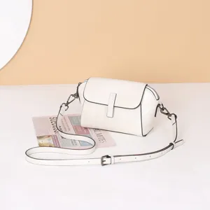 White genuine leather shoulder crossbody bag, vintage shell design with adjustable strap.