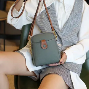 Genuine leather mini crossbody bag for women, stylish cowhide phone shoulder bag detail view.