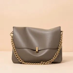 Grey leather shoulder bag for women with a stylish chunky gold chain strap and metal clasp.