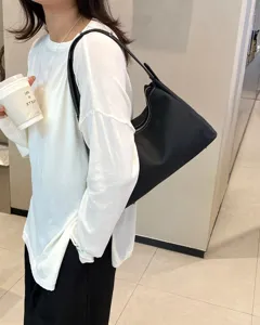 Fashion black leather underarm shoulder bag for women, stylish daily casual tote accessory.