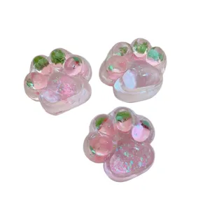 Adorable strawberry cat paw squeeze toy, translucent jelly resin stress relief fidget toy.