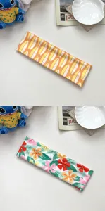 Detailed view of Hawaiian style floral and shell printed wide hairband for women summer.