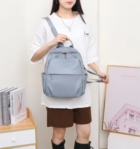 Genuine leather travel backpack for women, casual soft cowhide school bag with multi pockets.
