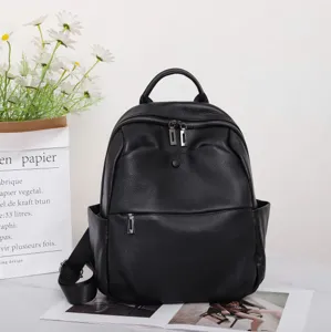 Genuine leather black backpack for women, stylish travel daypack with multiple pockets.