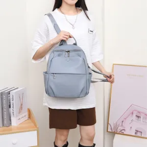 Casual genuine leather backpack for women, lightweight travel daypack, stylish school bag.