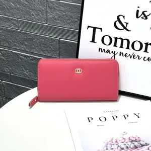 Pink genuine leather long wallet, chic design with card slots and zipper closure for women.