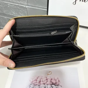 Interior details view of black genuine leather long wallet with multi card slots and zipper pocket.