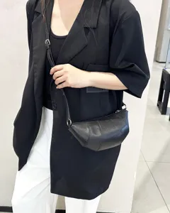 Stylish genuine leather croissant dumpling bag, versatile cross-body shoulder bag for daily commute.
