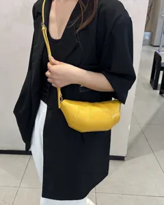 Yellow genuine leather croissant crossbody bag, stylish dumpling shoulder bag for women daily.