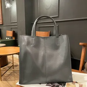 Genuine leather women's tote bag, retro minimalist top-layer cowhide shoulder bag detail view.