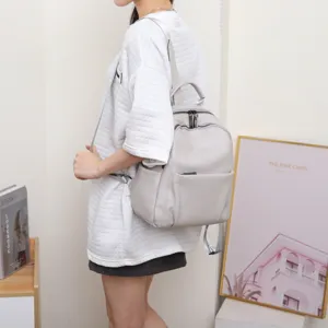 Stylish grey leather backpack for women, soft cowhide casual daypack with large capacity.