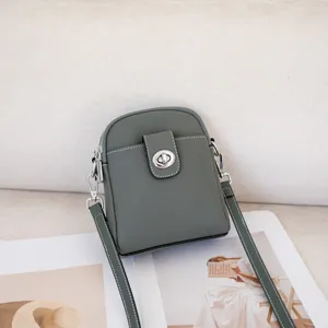 Genuine leather vertical crossbody phone bag, stylish togo cowhide mini shoulder bag for women.