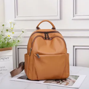 Genuine leather backpack for women, stylish soft cowhide school bag with large capacity brown.