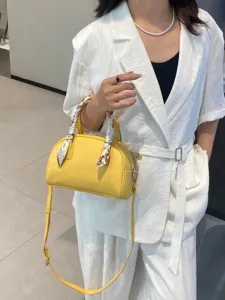 Bolso de mano de cuero amarillo tipo bowling para mujer, bandolera casual con pañuelo elegante.