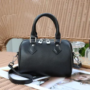Black genuine leather Boston bag detail, soft cowhide pillow handbag with shoulder strap.