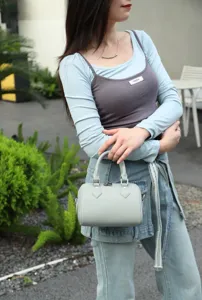 Genuine leather Boston handbag for women, soft top-handle pillow bag with elegant grey color.