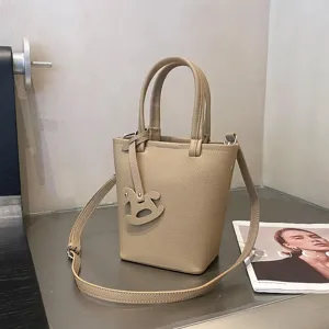 Klassische Leder Eimer Tasche mit Henkel und Schulterriemen, stilvolle Damen Umhaengetasche.