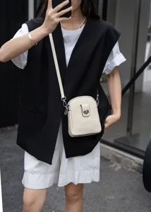 Genuine leather vertical phone crossbody bag for women, stylish small shoulder mini purse.