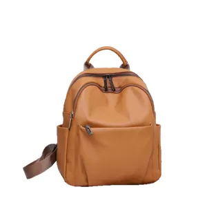 Genuine leather brown women's backpack, stylish soft cowhide school bag with large capacity.