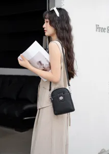 Genuine leather vertical phone bag for women, stylish crossbody shoulder bag with turn lock.
