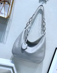 Detailed view of the genuine leather hobo shoulder bag with chunky chain strap and pebble grain texture.