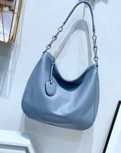 Blue genuine leather hobo shoulder bag detail, featuring slouchy design and chic chain strap.