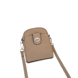 Stylish genuine leather vertical crossbody phone bag for women taupe pebble shoulder bag.