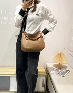 Brown leather hobo shoulder bag, slouchy design casual crossbody tote for daily wear.