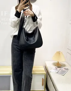 Black leather hobo shoulder bag detail, casual large capacity tote bag with chain strap.