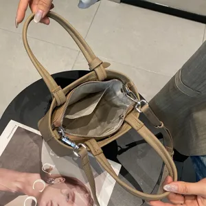 Elegante Echtleder Eimer Tasche für Damen, minimalistische Schultertasche mit Henkeln.