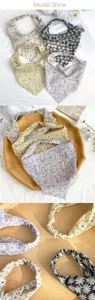Sciarpa triangolare elastica con stampa di margherite, perfetta per picnic primaverili.