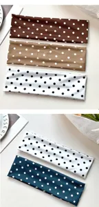 Polka dot elastic yoga headband detail showing soft fabric and assorted color options.