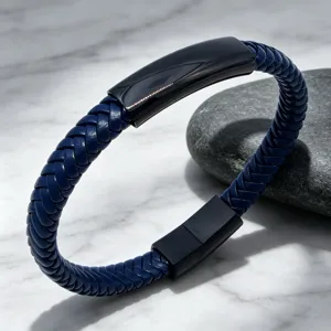 Detail shot of men royal blue braided leather bracelet with black titanium steel magnetic clasp.