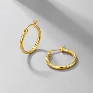 Detailed close-up showing the polished finish of 316L gold stainless steel hoop earrings.