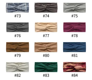 Detail view of elastic sweat-absorbing wide yoga sports headband variants in multi-colors.