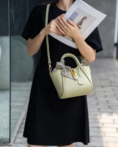 Light green genuine leather shoulder bag, stylish crossbody tote with metal lock and scarf.
