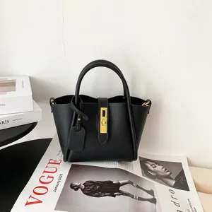 Black leather bucket bag with top handle and metal lock closure for women stylish daily wear