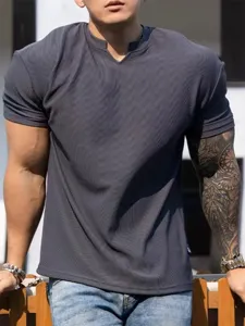 Men's dark grey ribbed athletic t-shirt detail showing textured fabric and v-notch neckline.