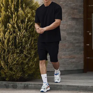 Men's casual sports t-shirt and shorts set solid color summer outfit detailed view.