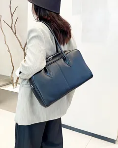 Genuine leather black commuter shoulder tote bag detail view, natural cowhide fashion handbag for women