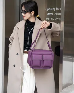 Purple genuine leather shoulder bag with double front pockets, stylish daily tote design.